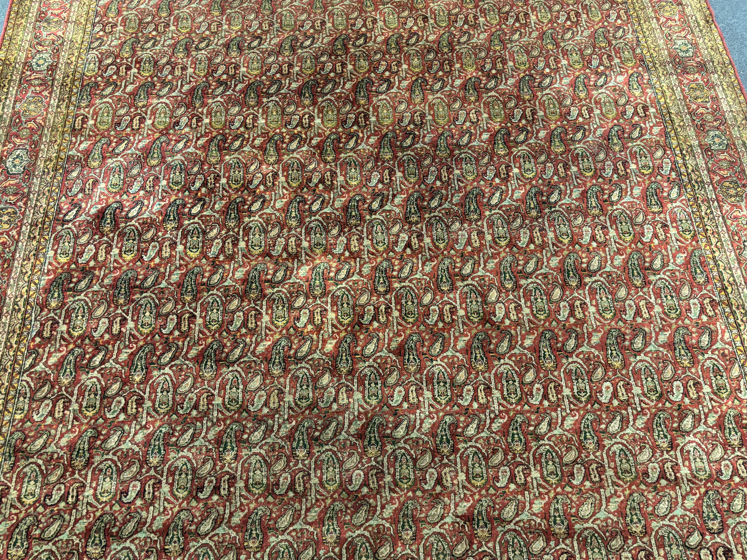 A Khorasan red ground carpet, approximately 12ft. X 9ft. (damage to one small area neatly repaired)